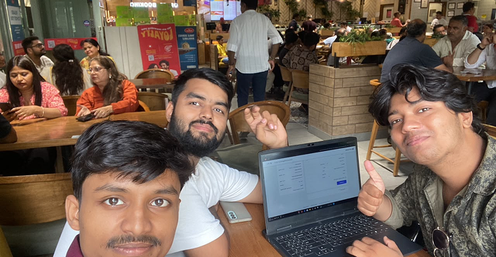 The ThisBrand team working together at a café